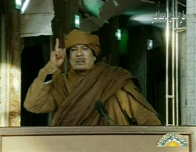 Libyan leader Moammar Gadhafi addresses the nation in Tripoli, Libya on state television Tuesday, Feb. 22.  Gadhafi is arming civilian supporters to set up checkpoints and roving patrols around the Libyan capital to control movement and quash dissent, residents said Saturday.